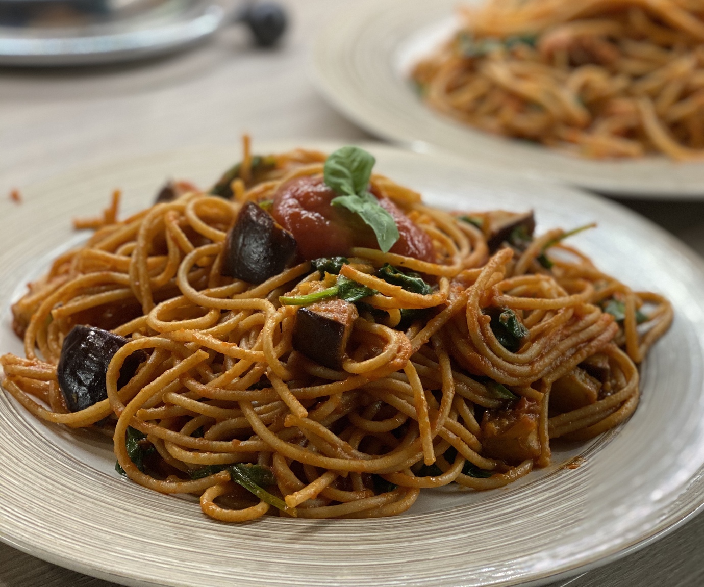 Pasta with tomato, spinach and aubergine